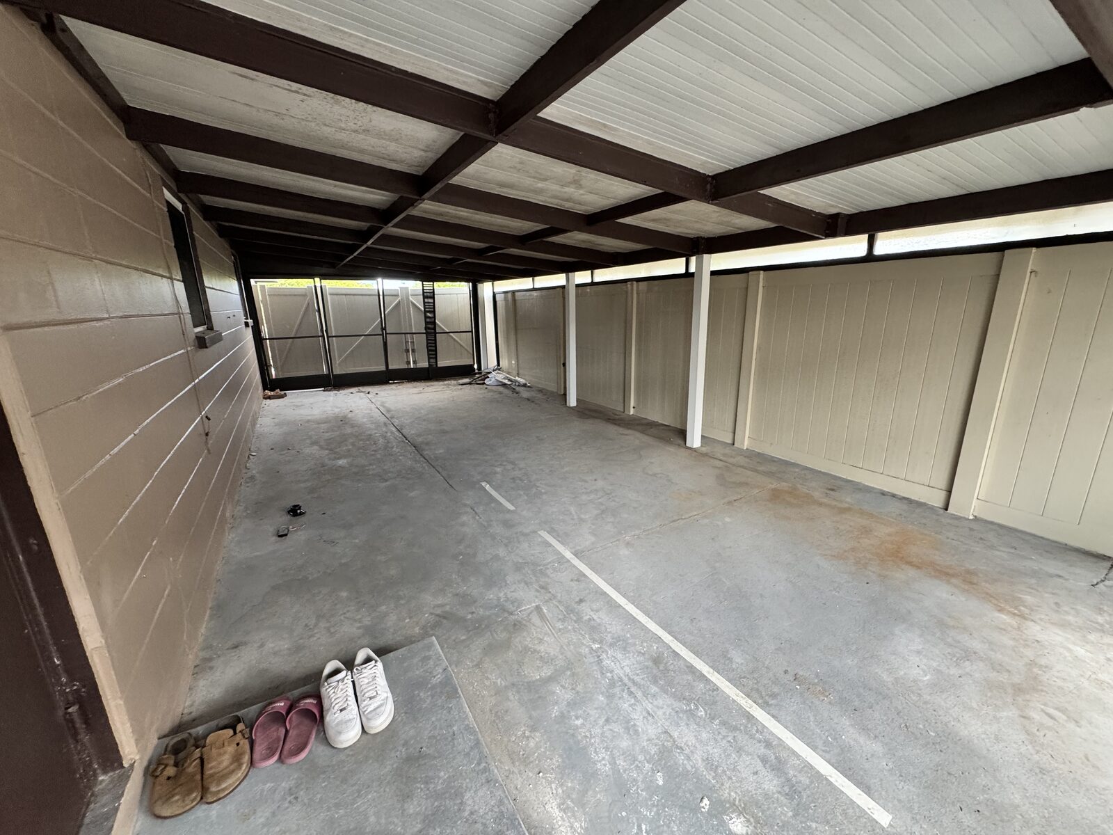 Two-car covered carport alongside the home